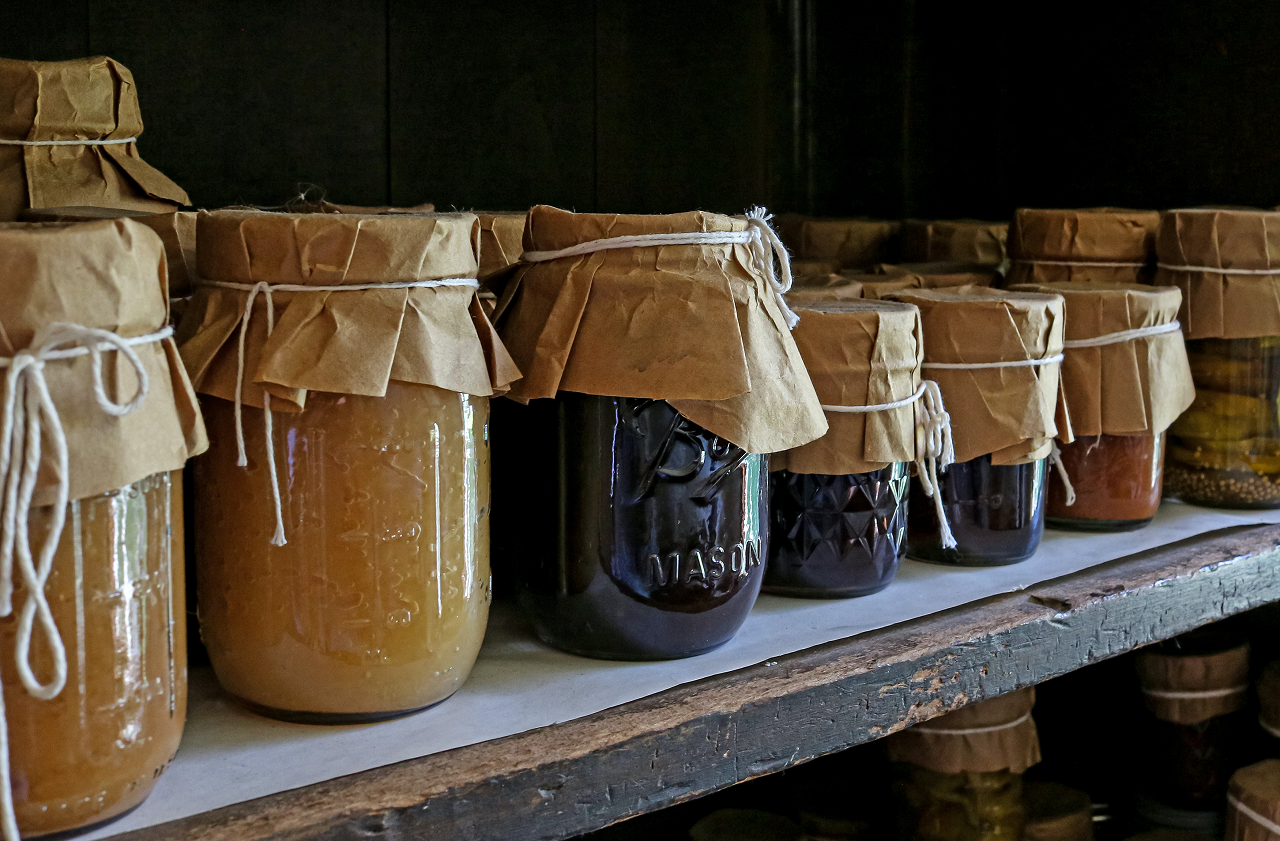 Image of canned food on a shelf.