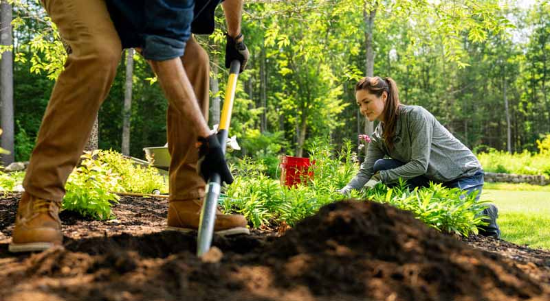 Man and Woman working on landscaping