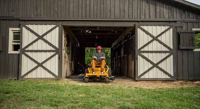 Homeowner tackling yard maintenance with riding mower